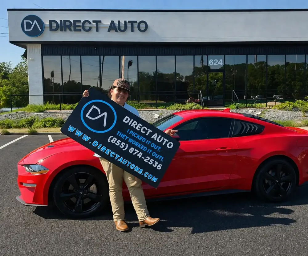 Direct Auto customer with a red Mustang